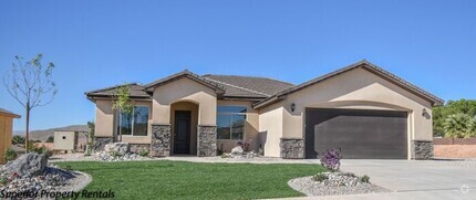 Building Photo - 4 bed, 2.5 bath home, 2 car garage with a ...