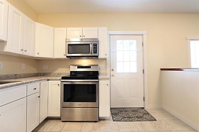 Kitchen looking at entrance to apt - 881-1 Concord Ave