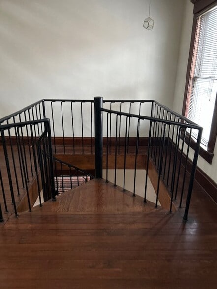 2nd floor, top of staircase - 179 E Kossuth St