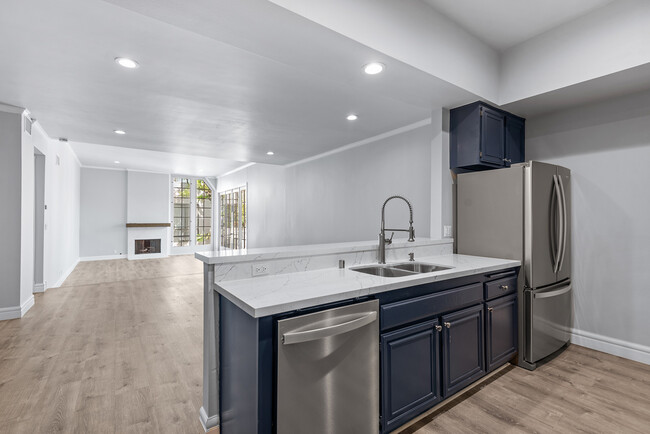 Kitchen opens to dining room and living room - 1260 S Beverly Glen Blvd