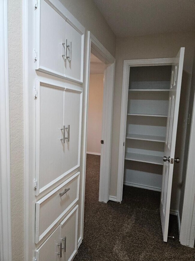 Building Photo - Three bedroom and two bathroom nicely remodeled with new flooring. Large wood fenced backyard