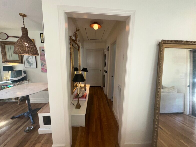 Hallway to bathroom and 2 bedrooms - washer/dryer. - 5623 Meadowcrest Ln