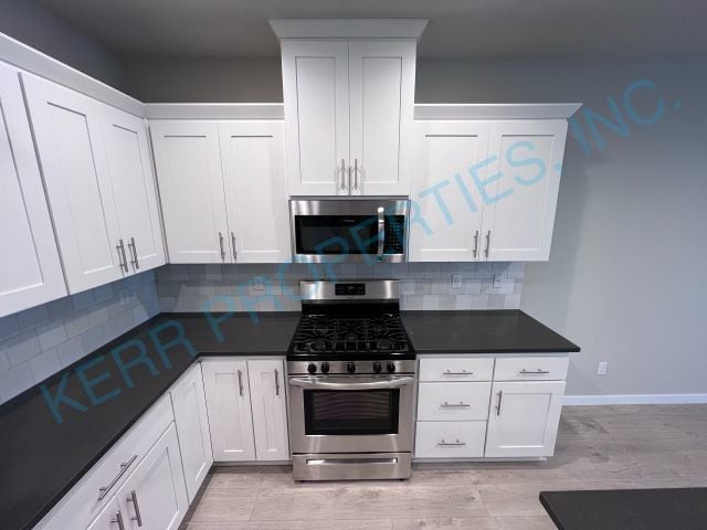 Building Photo - FREE RENT! Modern townhome living 3-Bed Retreat with 2.5 Baths in Serene Happy Valley!