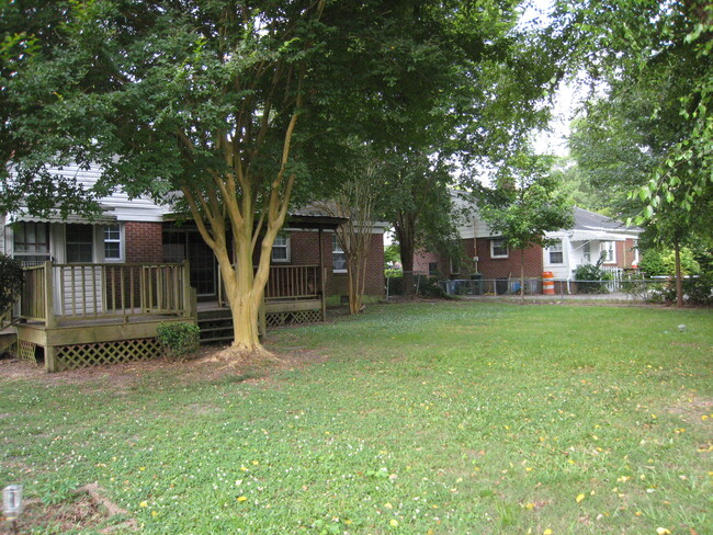 Large fenced backyard. - 1911 E 4th St