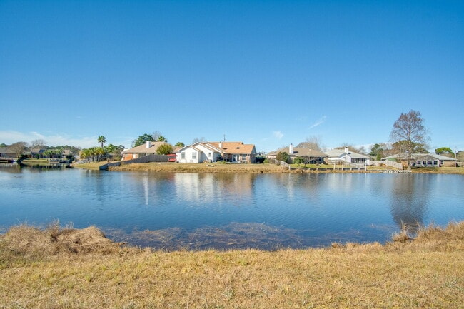 Building Photo - Lakefront 3BR/2BA Home on Orion Lake with Florida Room, Screened Patio, Hot Tub (As-Is), Solar Pa...