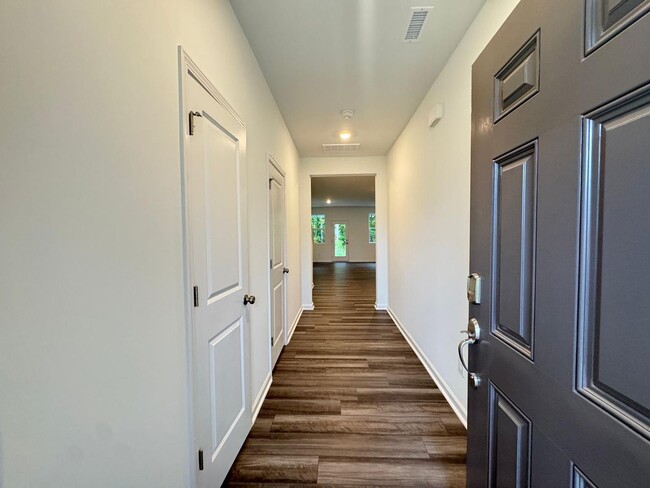 Building Photo - STUNNING BRAND-NEW TOWNHOUSE in a very con...