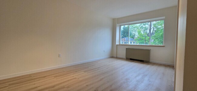 Building Photo - Everything is new! Harvard Sq! Walk to T! Large 1bd with balcony! Parking included!
