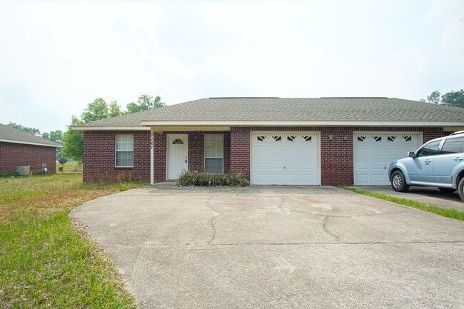 Building Photo - Don’t Miss This Milton Duplex — 2BR/2BA Brick Home with Garage, Walk-In Closet, Open Living Space...