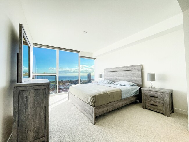 Building Photo - Furnished Symphony Condo with Direct Ocean Views and Two Parking