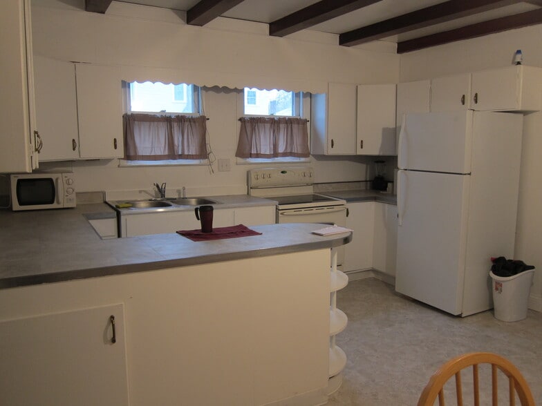 Kitchen has a dish washer, stove and refrigerator. - 1445 South Center Street