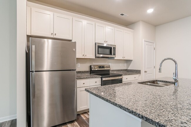 Building Photo - FIRST MONTH FREE - 3BR Townhome • Full Kitchen • Garage + Driveway