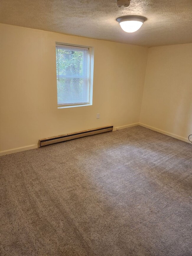 Building Photo - Affordable Apartment Outside the City Limits