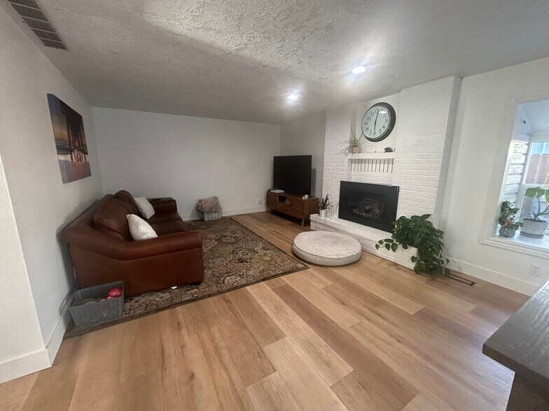 Family room with gas fireplace - 10377 W Alliance St