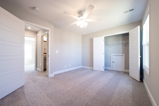 Building Photo - Elegant Home with Stone Fireplace, Kitchen Island and Designer Primary Suite