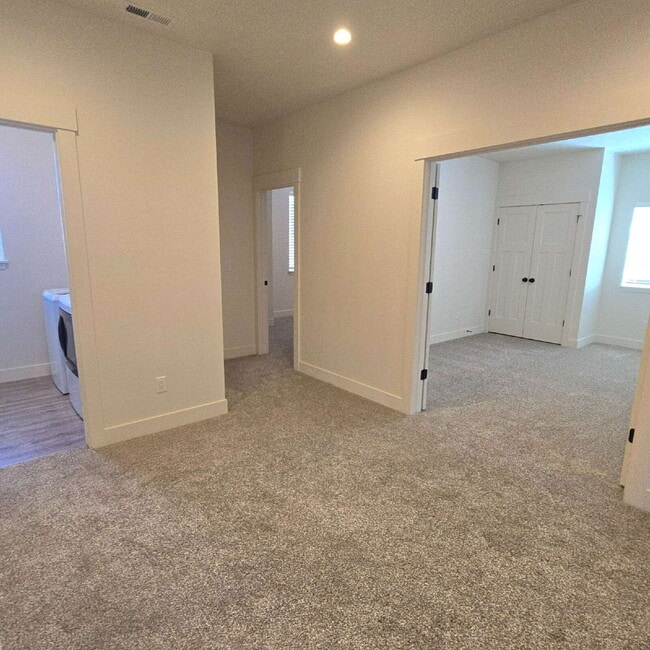 Building Photo - Move-in ready! 4 bedroom house with 3 car ...