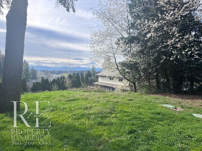 Building Photo - Private Retreat with Expansive Yard & Loft Space