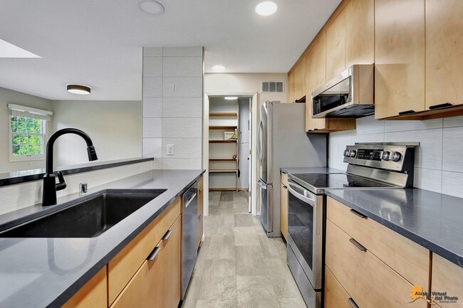 Building Photo - Spacious and bright condo located in a quiet area that boasts the perfect combination of style an...