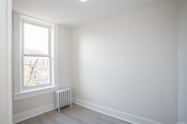 Building Photo - 67-17 Myrtle Ave