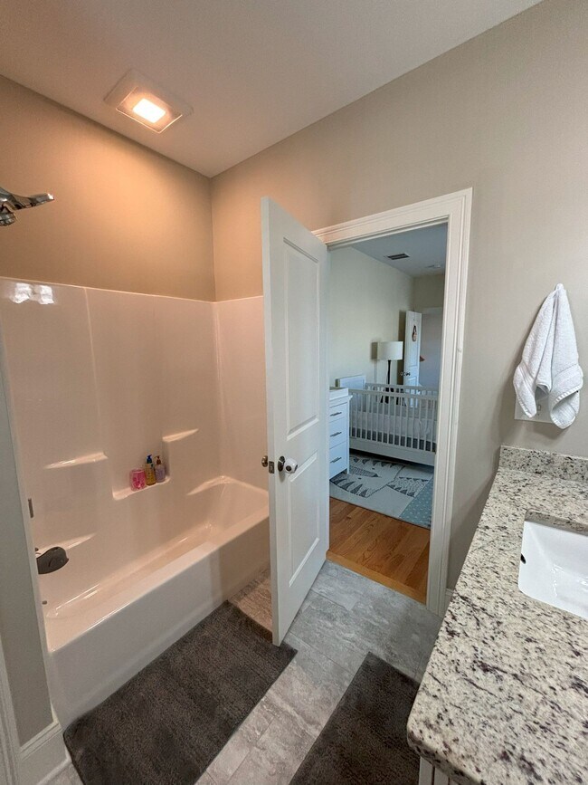Main floor, full bath with tub attached to bedroom. - 140 Wells View Rd