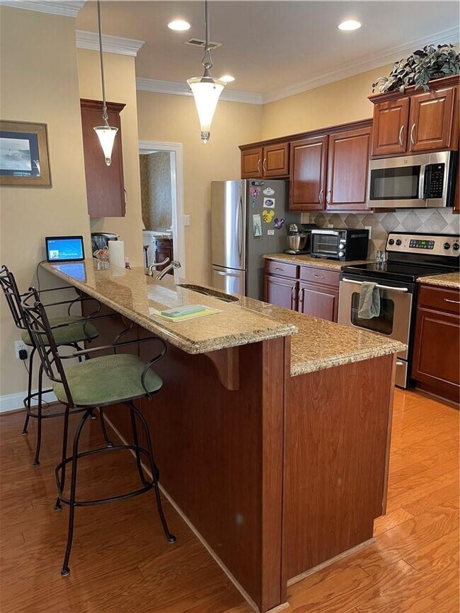 Building Photo - Updated four bedroom home First floor master, maintenance free with club house