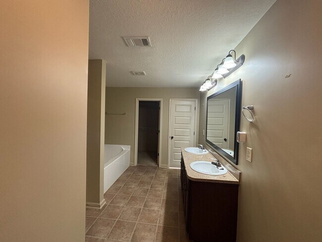 Building Photo - This property blends ample living space and storage with functional amenities.