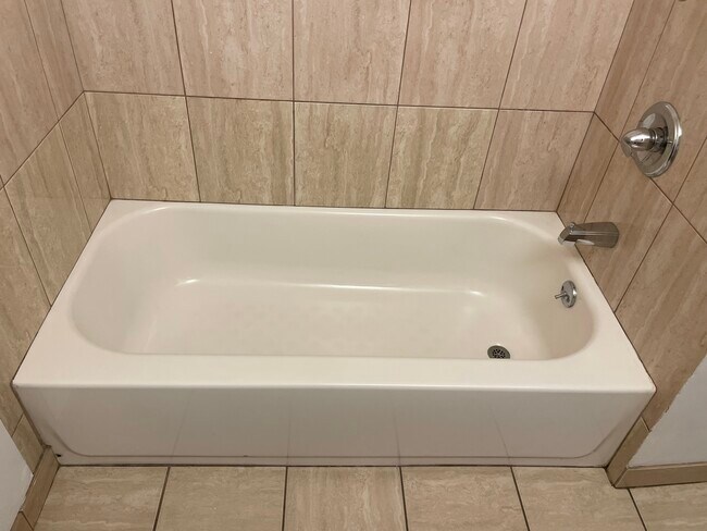 hallway full bathroom with tub - 19406 Archwood St