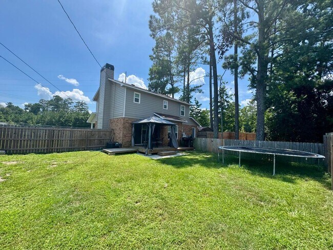 Building Photo - Move-In Ready Corner-Lot Home with Wraparound Porch Near Fort Eisenhower