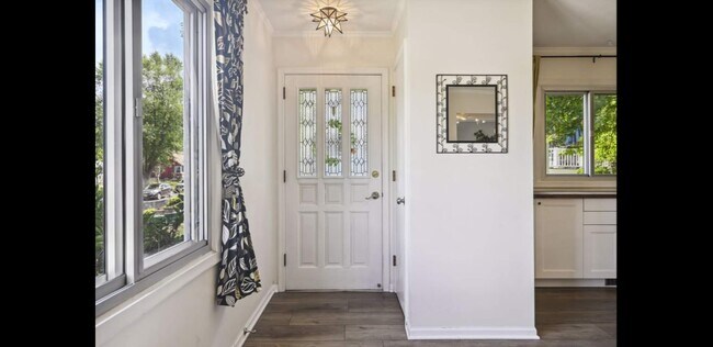 Welcoming front entry offers 2 front closets & extra mudroom space for boots & coats - 2740 Alabama Ave S