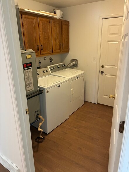 Laundry room with cabinet storage - 5601 N Humboldt Ave