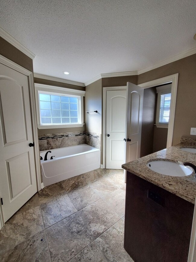 Building Photo - Spacious 4-Bedroom Home with Open Layout, Granite Finishes & Fenced Yard