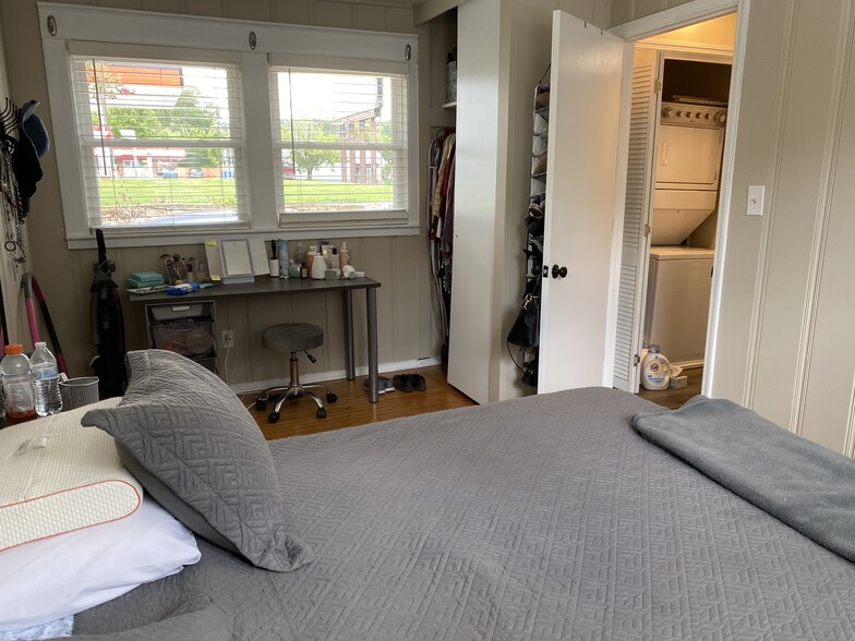 New windows with 2 inch blinds, refinished hardwoods in bedroom, ceiling fan - 604 1/2 Ward Avenue N.E.