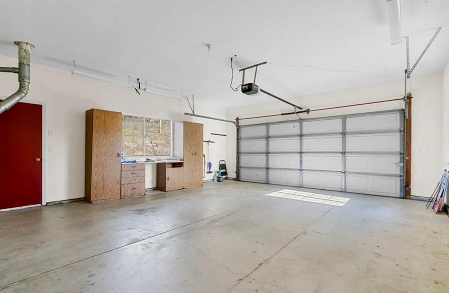 Oversized two car Garage (note: cabinetry has been removed). - 221 Appy Way