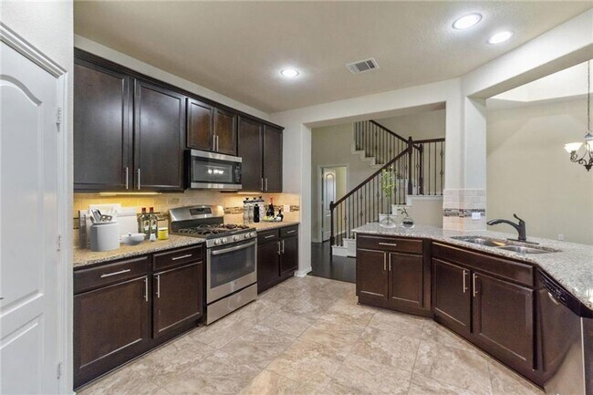 Building Photo - One-and-a-half story, 4 bedroom home - Available early June!