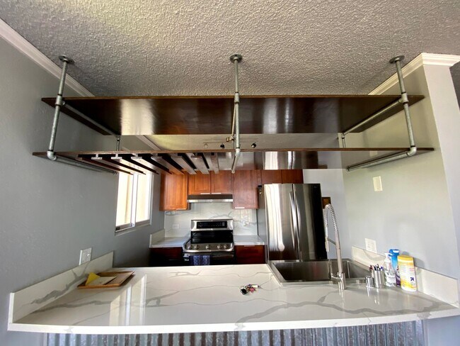 Building Photo - LELE PONO - Desirable high-rise in Pearlridge area. 2 bedrooms, 2 bath, 1 assigned parking stall,...