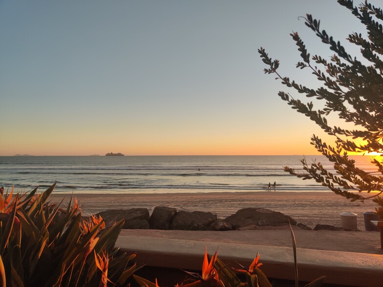 A sunset on the beach in front of our building - 1830 Avenida Del Mundo