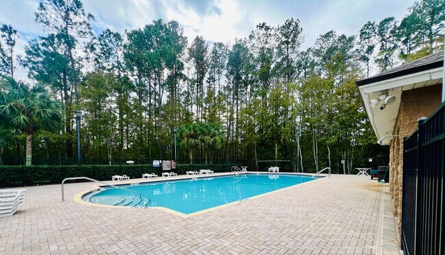 Building Photo - Gated Comfort Condo, Poolside Vibes: Your Next Home Awaits at Merrill Pines