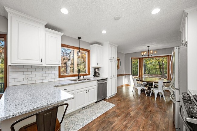 Building Photo - Stunning Remodeled 4BR Home w/ Pond View & 3-Seasons Porch!