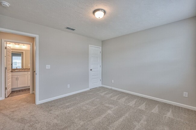 Building Photo - Brand New Luxury Townhome! 3 BR, 2.5 BA, 2 Car Garage, Pool, Dog Park, and More!