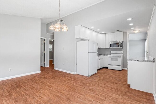 Building Photo - NE – Desirable Neighborhood, Brick Home, Wood/Laminate Flooring, Vaulted Ceilings, Carport, Fenced!