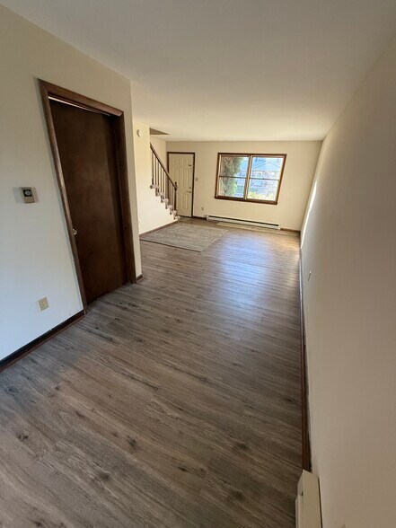 Large living area features brank new lvp flooring - 1004 Corbett St