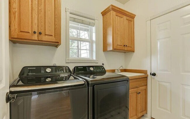 Building Photo - Spacious Four-Bedroom Home with Gourmet Kitchen, Multiple Living Areas, Loft, and Beautifully Lan...