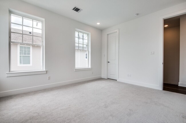 Building Photo - Welcome to a beautiful Craftsman-style Tow...