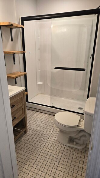 New tile, vanity, shower w/ glass door, modern shelving - 208 Line St