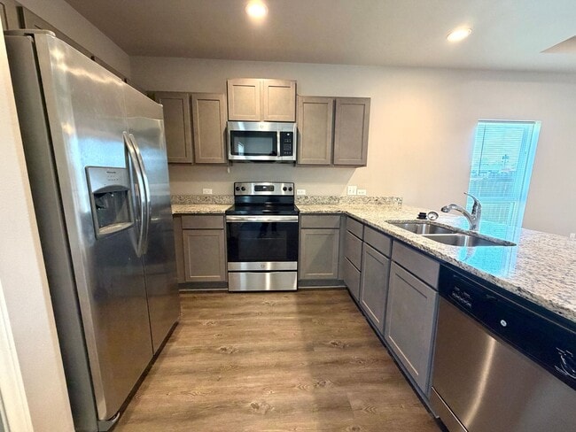 Building Photo - Corner Unit Townhome with 3 Bedrooms, Garage & Private Yard