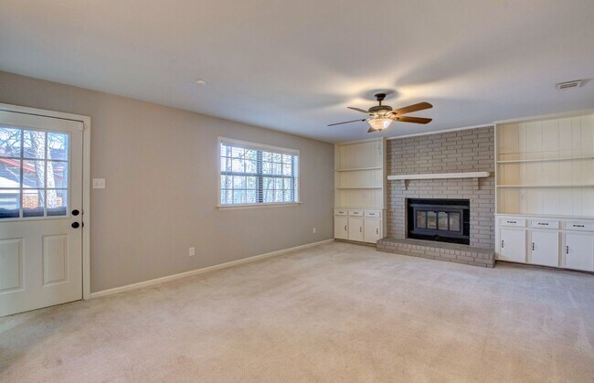 Building Photo - Welcome Home: Charming Brick Beauty with Covered Porch.