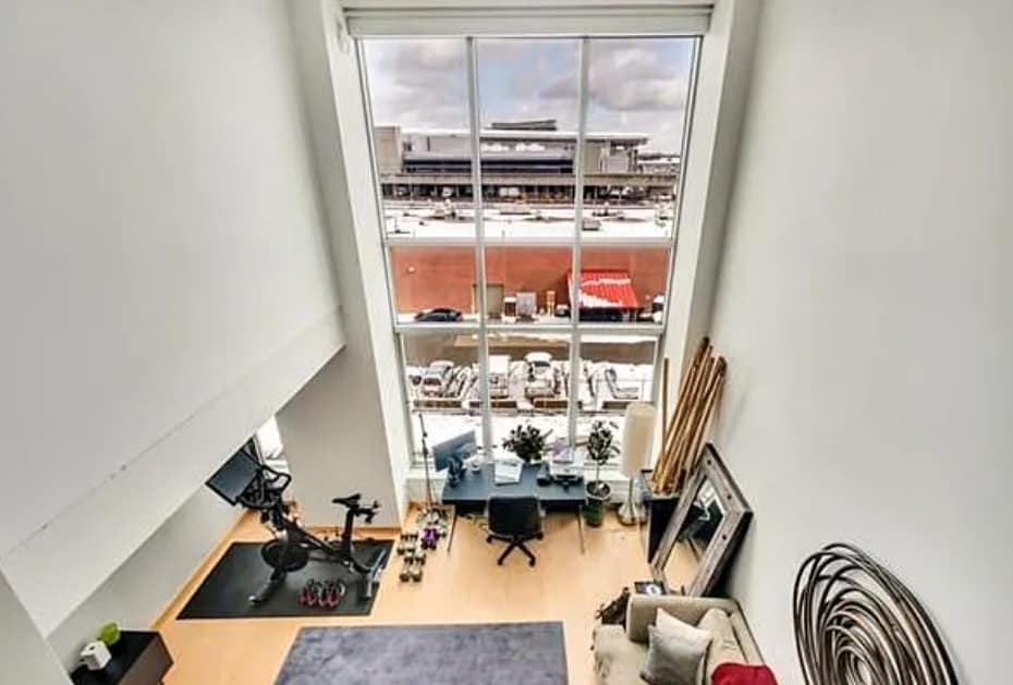 Floor to ceiling window (with electric curtain) as seen from mezzanine - 25 Channel Ctr St