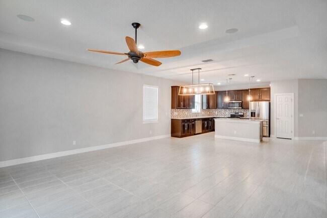 Building Photo - Stunning 3-Bedroom Pool Home with Bonus Room in the Gated Community of Lakeshore at Narcoossee