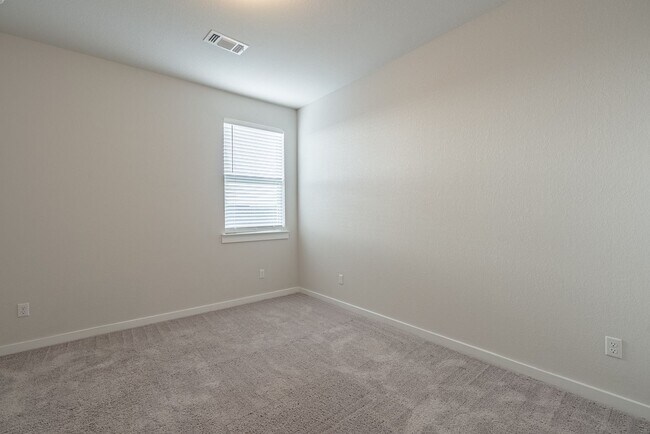 Building Photo - Spacious Buda Beauty Offering Open-Concept Living and Flexible Space for Every Lifestyle!