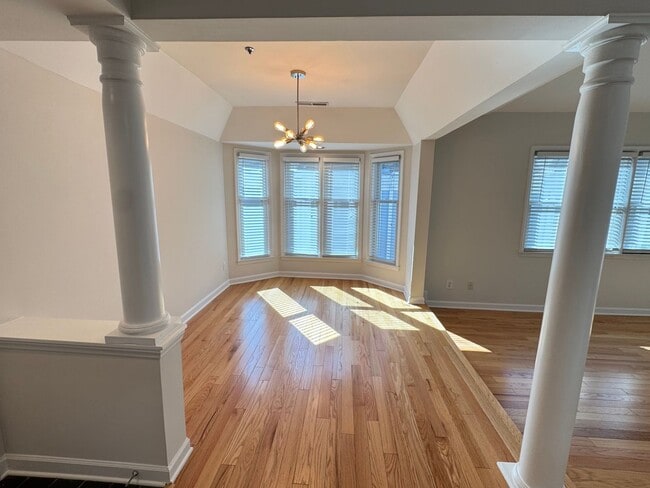 Building Photo - Top-Floor End Unit Condo at New Bern Place