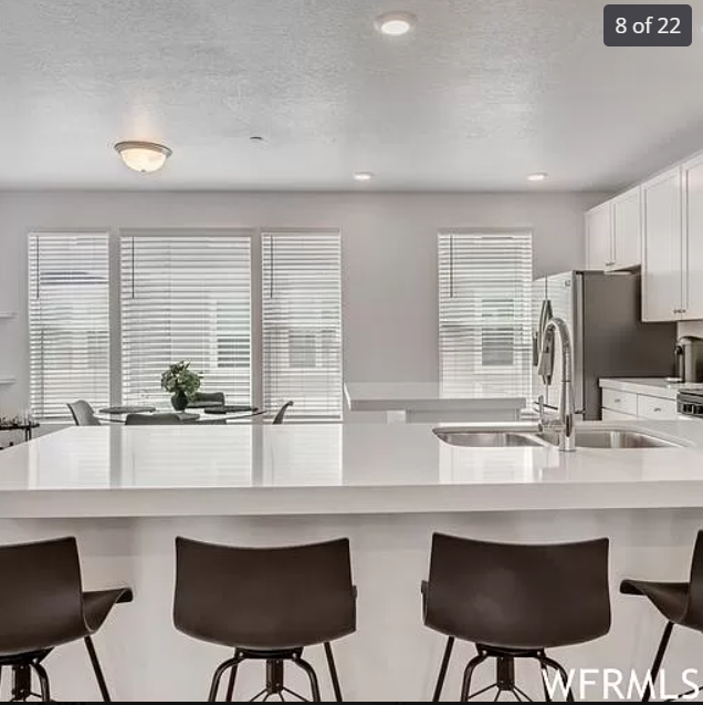 Gourmet kitchen, gas stove, white quartz countertops white cabinets. - 3836 W Cardenden Ln